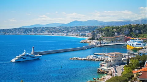 View of the Mediterranean Sea with the lighthouse in the harbor in Nice. Stock Footage 247220330