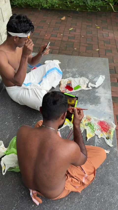 View of men applying traditional makeup for a performance in India. Video stock 334996980