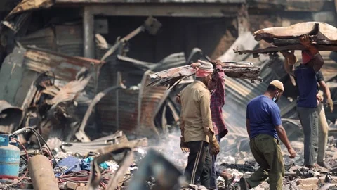 View of men clearing debris and metal sheets in Dhaka, Bangladesh Stock-Footage 335600232