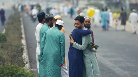 View of men hugging during Eid celebrations in Bogura, Bangladesh. Video stock 334991990