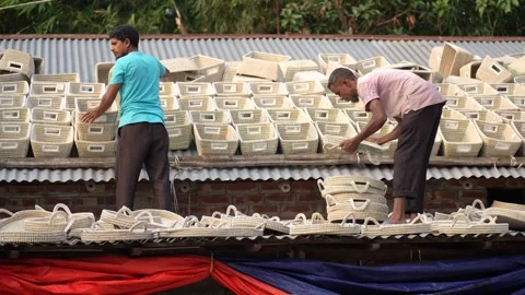 View of men organizing woven baskets in Bogura, Bangladesh. Video stock 334949153