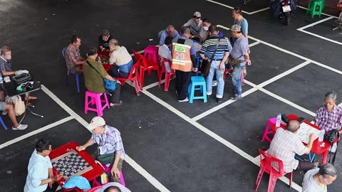 View of men playing chinese chess on the street of Bangkok. Stock Footage 278911349