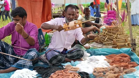 View of men preparing traditional kite string in Bogura, Bangladesh. Video stock 335012861