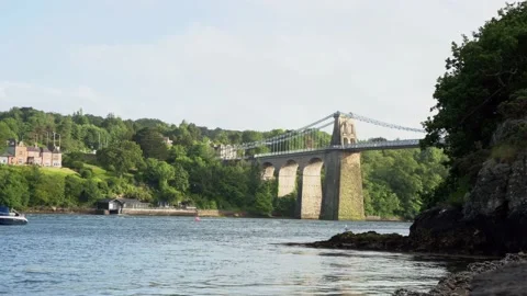 View of Menai Suspension Bridge underneath during sunset hour in the summer Stock Footage 199085751