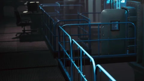 View of a metal railing in an industrial setting at night Stock Footage 344971300