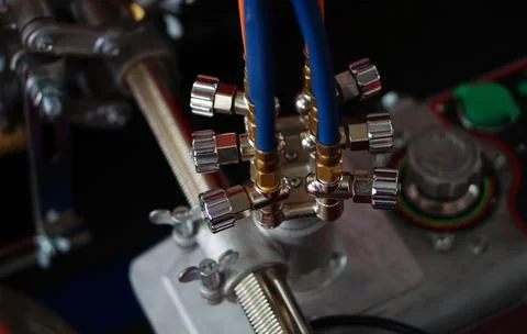 View of metal rotary round knobs controls of a  machine in a industry 스톡 사진