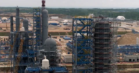 View of the metal structures of a large factory from a drone Stock Footage 138255519