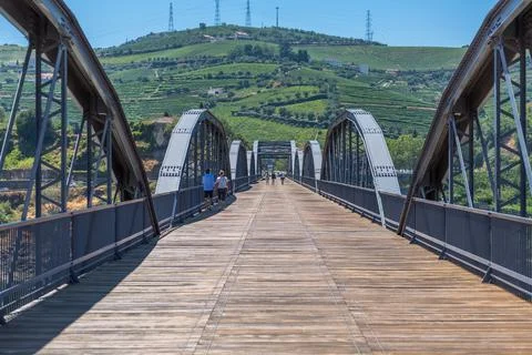 View at the metallic bridge over Douro river on the Peso da Regua downtown Stock Photos