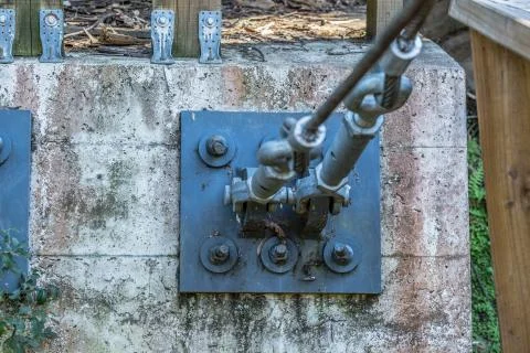 View of metallic cable fastening element with stretcher, concrete slab Stock Photos