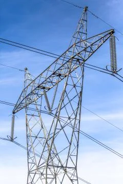 View of metallic structure tower and power lines Stock Photos