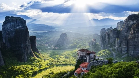 View of Meteora valley, daytime, sunrays, clouds, monasteries - timelapse Stock Footage 112825071