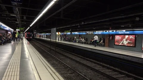 View of metro train arrive in Barcelona subway station people commuter transport Stock Footage 81981850