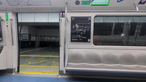 View of metro train doors opening and closing during stop at urban transit .. Stock Footage 335873957