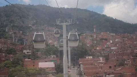 View of metrocable cabins from a moving booth Stock Footage 91555469