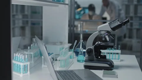 View of microscope portable computer test tubes with liquids in holders 스톡 동영상 280060896