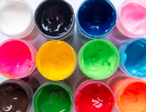 View milestone on open packages of multi-colored paint Stock Photos