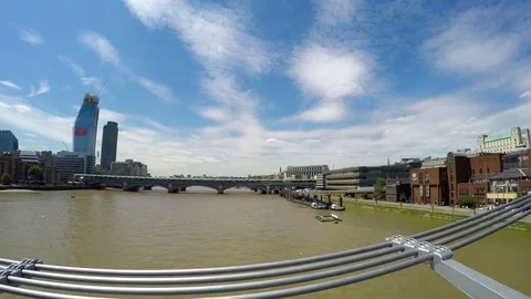 View from Millennium Bridge to Thames River and people walking on the bridge Stock Footage 79503382