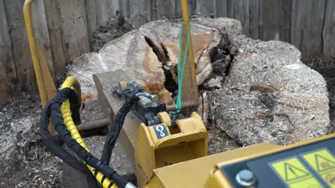 View of the milling head of the stump cutter from the control panel location. Stock Footage 154769013