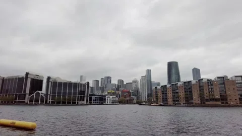 The view of Millwall Outer Dock with Canary Wharf in the Background Stock Footage 153966075
