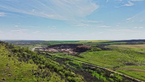 View of a mining site in a green valley during daytime Stock Footage 338240914
