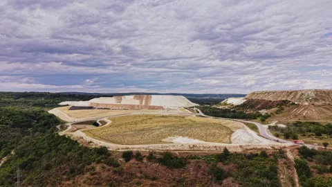 View of mining site with hills and clouds in sky during daytime Stock Footage 339649902