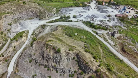 View of a mining site showing extraction areas and environmental features in a Stock Footage 340177647