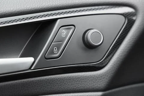 View of mirror and lock controls on door panel in modern car, closeup Stock Photos