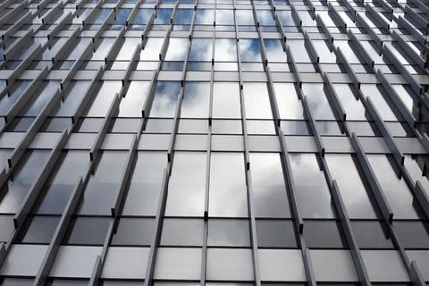 View of a modern building facade emphasizes its geometric structure. The ve.. Fotos de archivo