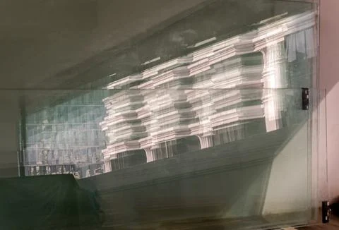 View of Modern building pattern on reflective plate glass leaning against t.. Stock Photos