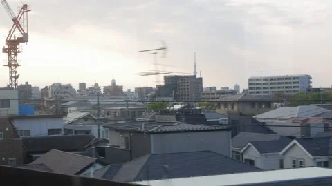 View of modern buildings from moving train window while moving crossing bri.. Vidéo 336472968