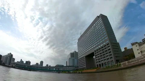 View of the modern buildings on the side of the canal in Osaka Japan Stock Footage 129278040