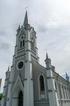 View of the modern Catholic Cathedral on the background of clouds. The buildi Stock Photos