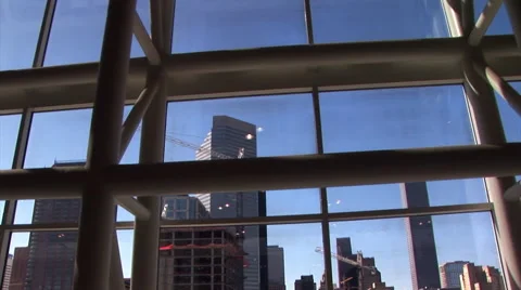 View of modern downtown buildings while traveling down an escalator Stock Footage 63300969