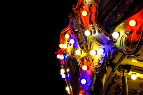 View of modern energy saving light bulbs on a lovely vintage style carousel ride Stock Photos