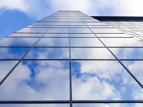 View of a modern glass skyscraper Stock Photos