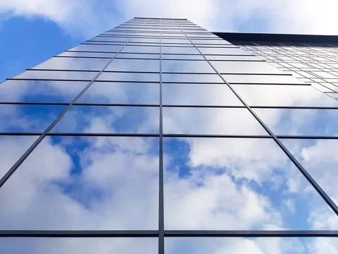 View of a modern glass skyscraper Stock Photos