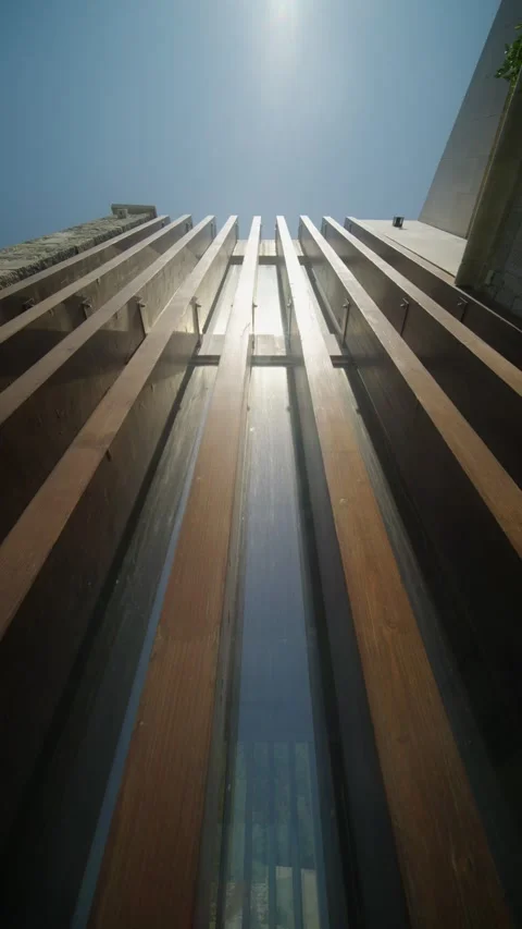 View of a modern loft wall with sunlight shining on the exterior structure from Stock Footage 327011999