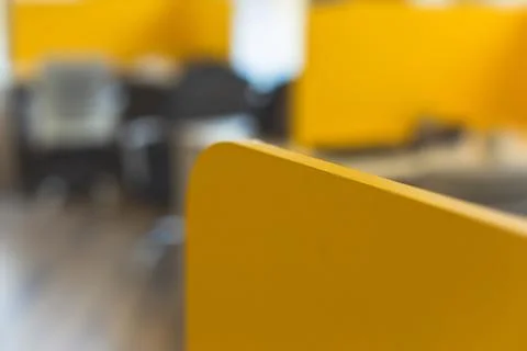 View of modern office space interior with desks in yellow tones with workers, Stock Photos