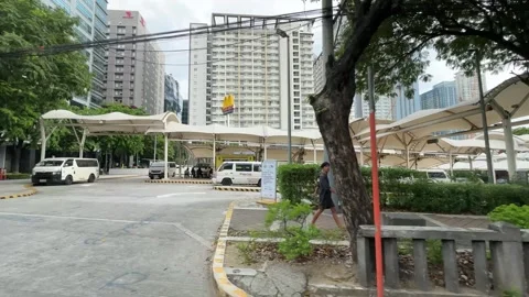 View of a modern performing arts theater from a vehicle in BGC 4K 스톡 동영상 337950970