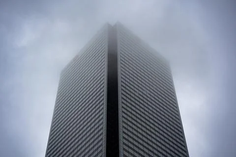 View of modern skyscraper disappearing into dense fog. Toronto, Canada - June 25 Foto stock