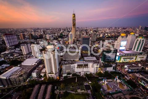 View of modern skyscrapers in Siam at sunset, in Bangkok, Thailand. Stock Photos