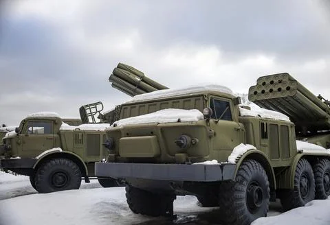 View of modern types of multiple rocket launchers in the parking lot after sn Stock Photos