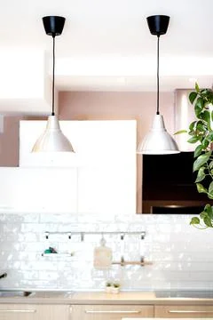 View of a modern white kitchen interior Stock Photos