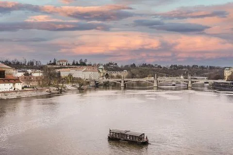 View of Moldava or Vltava River at sunset located in Prague, Czech Republic. Stock Photos