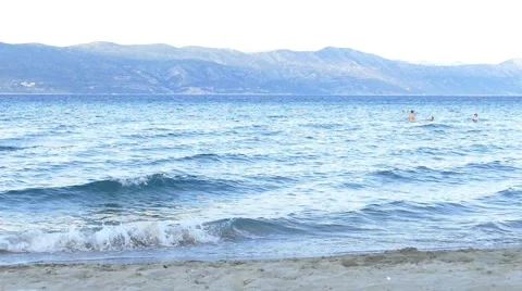 View on Montains And Waves on Sandy Beach Stock Footage 54912419