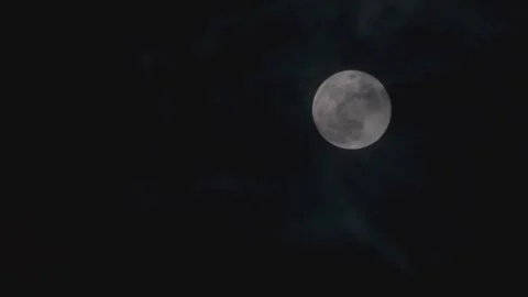 View of the Moon Between the Clouds Stock Footage 293413764