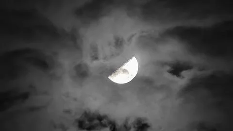 View of the moon with a cloudy sky Stock Photos