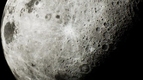 View of the moon showing craters and surface details during nighttime Stock Footage 344390258
