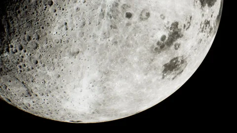 View of the moon showing surface details and craters at night Stock Footage 344391066