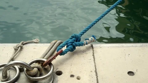 View of a moored boat at a dock on a concrete pier Stock Footage 113291475